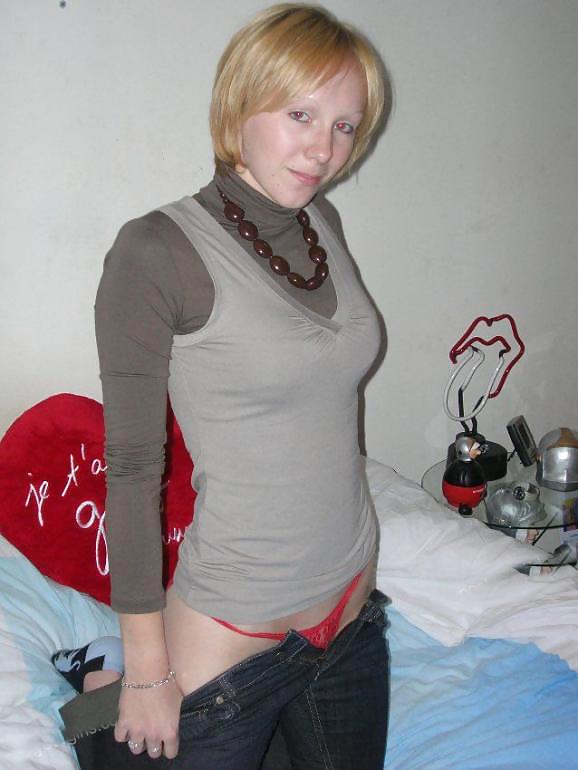 Blonde Cutie posing on her bed porn gallery