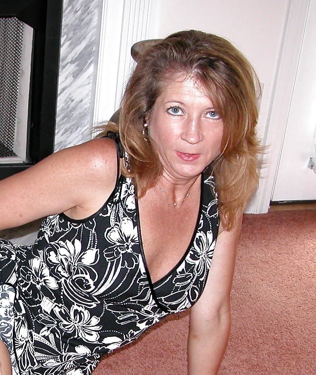 Mature Wife Carol, Posing By The Fireplace porn gallery