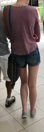A tall tight mall teen from behind