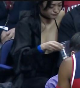 Dirty Asian slut showing massive cleavage at NBA game porn gallery