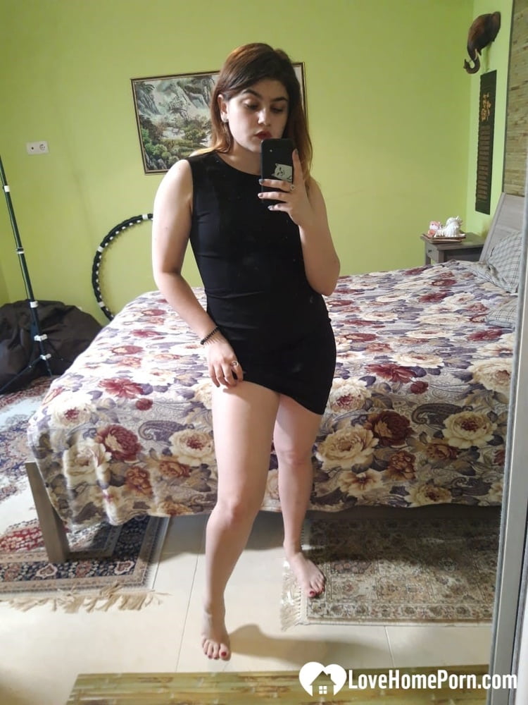 Naughty brunette strips off her black dress - 17 Photos 