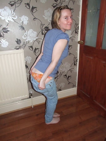 cute blonde posing in jeans and shirt         