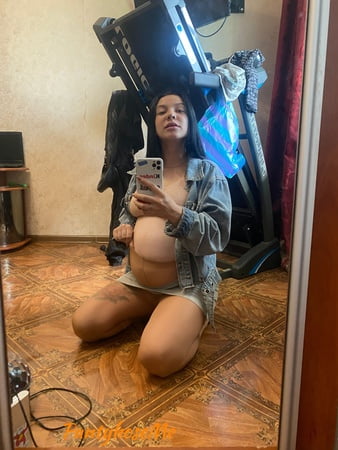 pregnant brunette in sheer pantyhose         