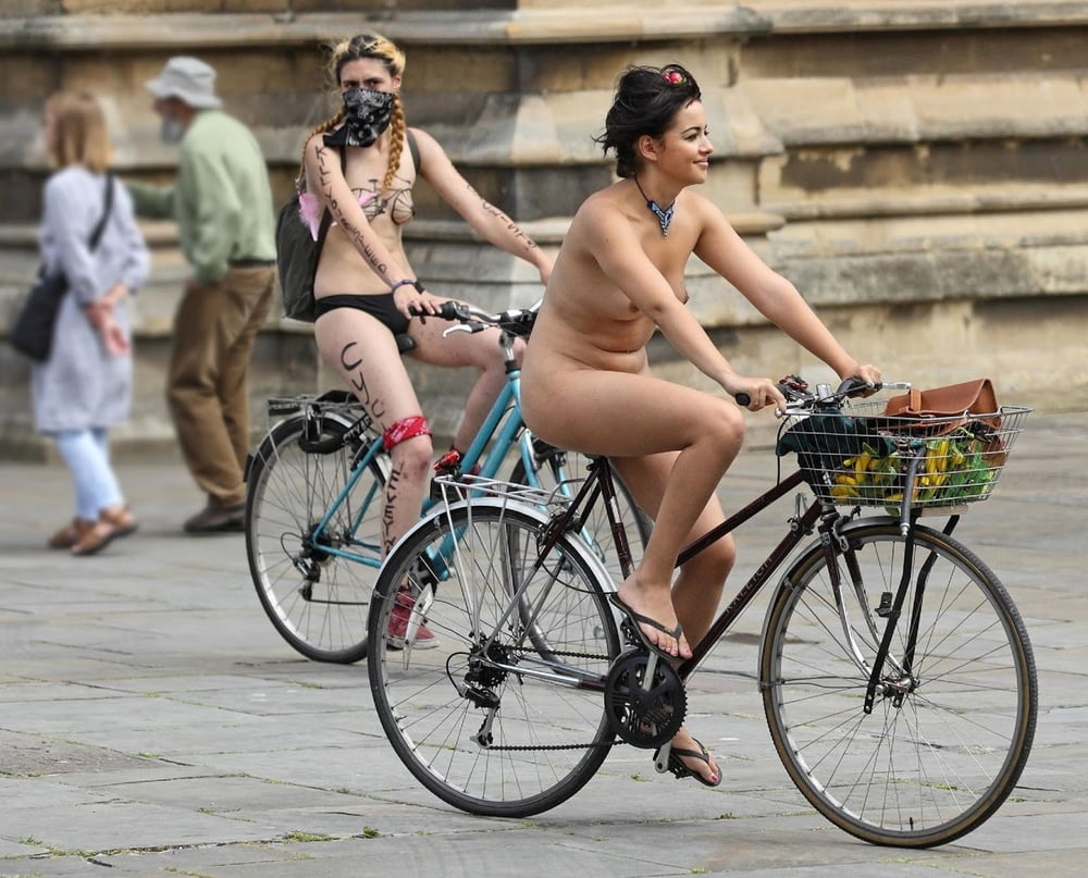 Survivor girl naked on bicycle.