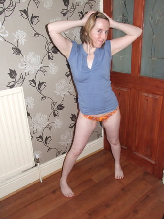 cute blonde posing in jeans and shirt         