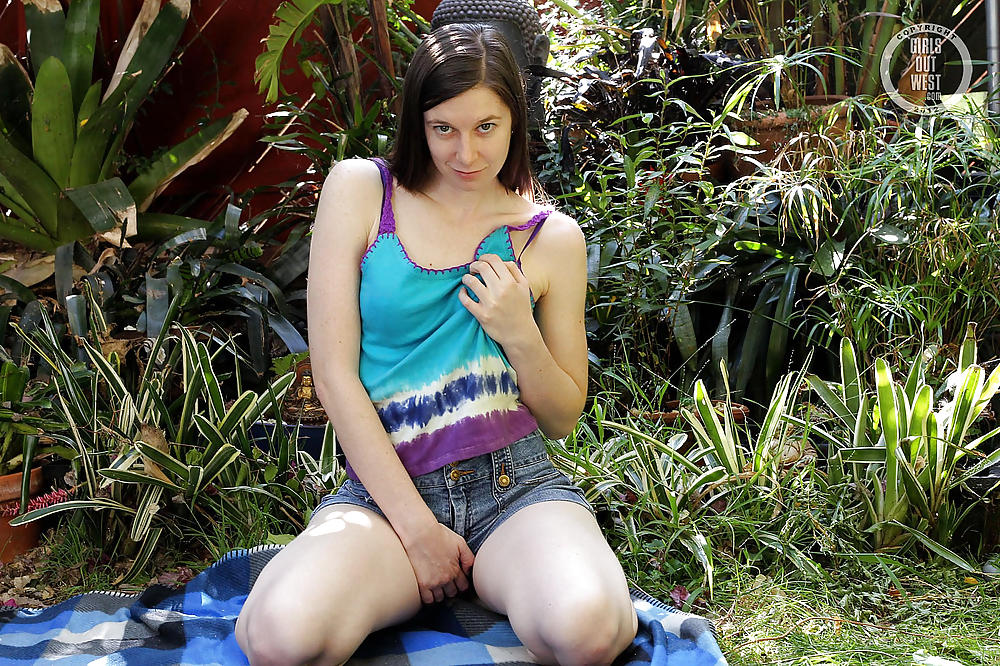 A pale Australian girl playing with a toy outdoors porn gallery