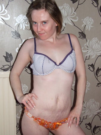 cute blonde posing in jeans and shirt         