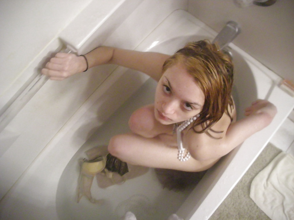 Gorgeous girl goes naked in bath tub porn gallery