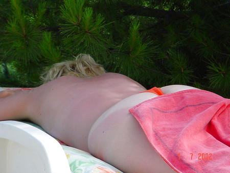 blond french milf tanning close the pool